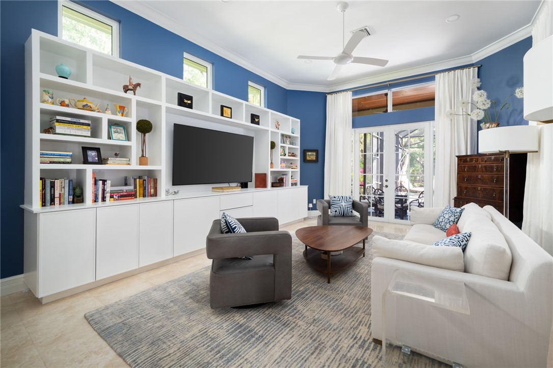 Convenient to the kitchen with new built ins and french doors.