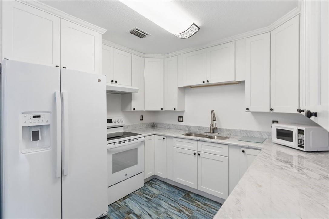 Kitchen with New Refrigerator & Range