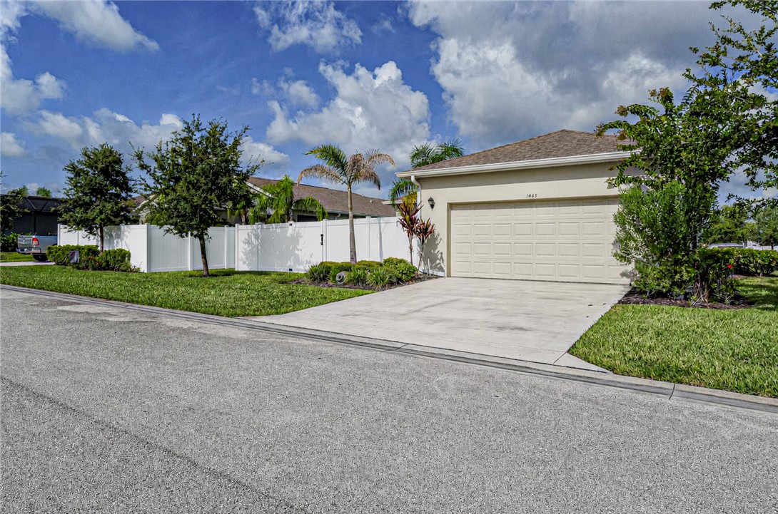 Single-story residence featuring a two-car garage, concrete driveway, and stucco exterior