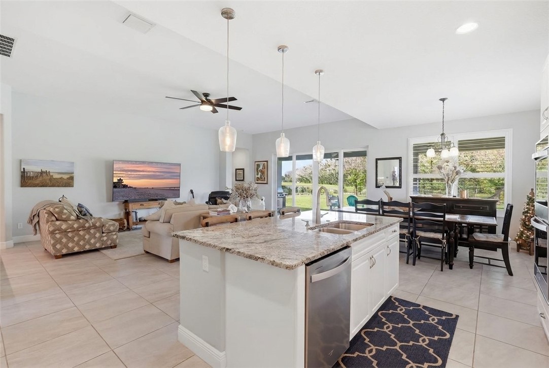 Kitchen island with granite countertop and undermount double sink