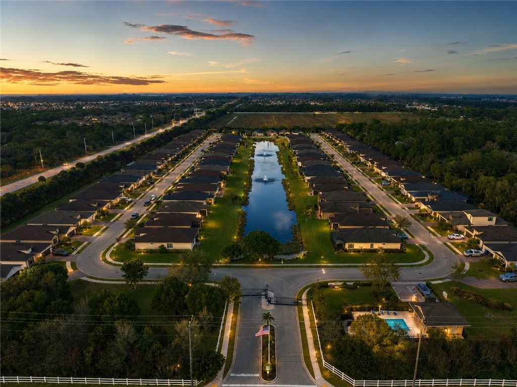 Aerial perspective showcasing a residential community with a central water feature