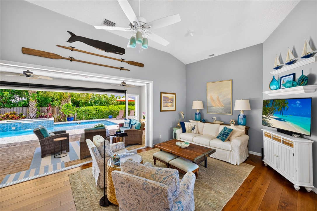 Pocket slider opens living room to screened Patio