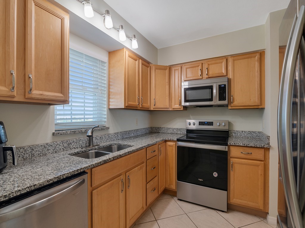UPDATED KITCHEN WITH GRANITE TOPS AND STAINLESS APPLIANCES