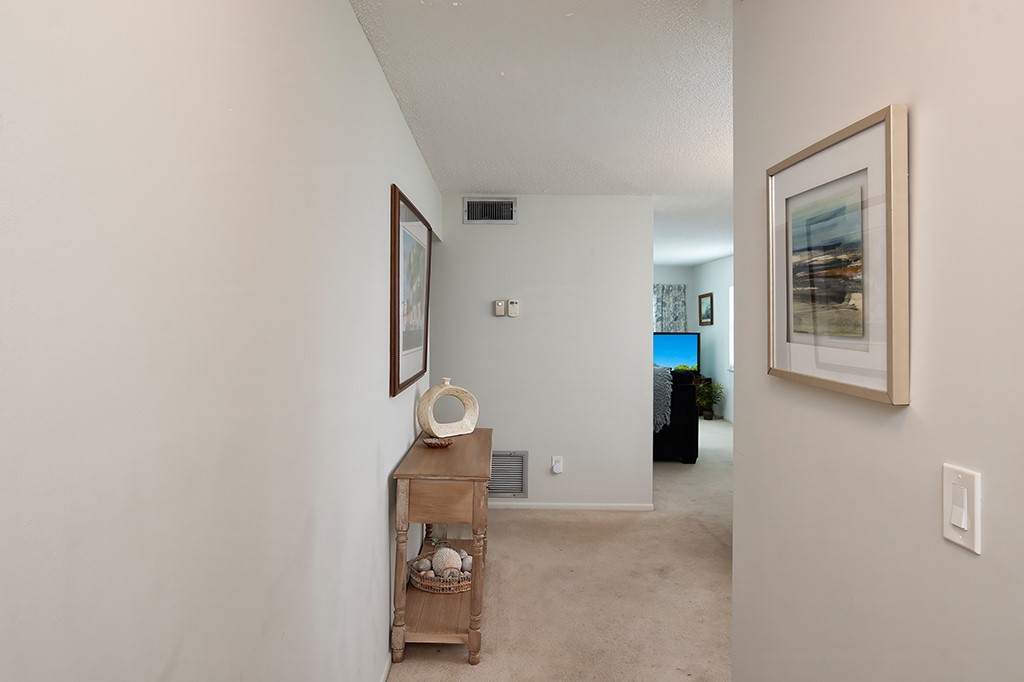 Light-toned carpet flooring provides a continuous surface throughout the interior