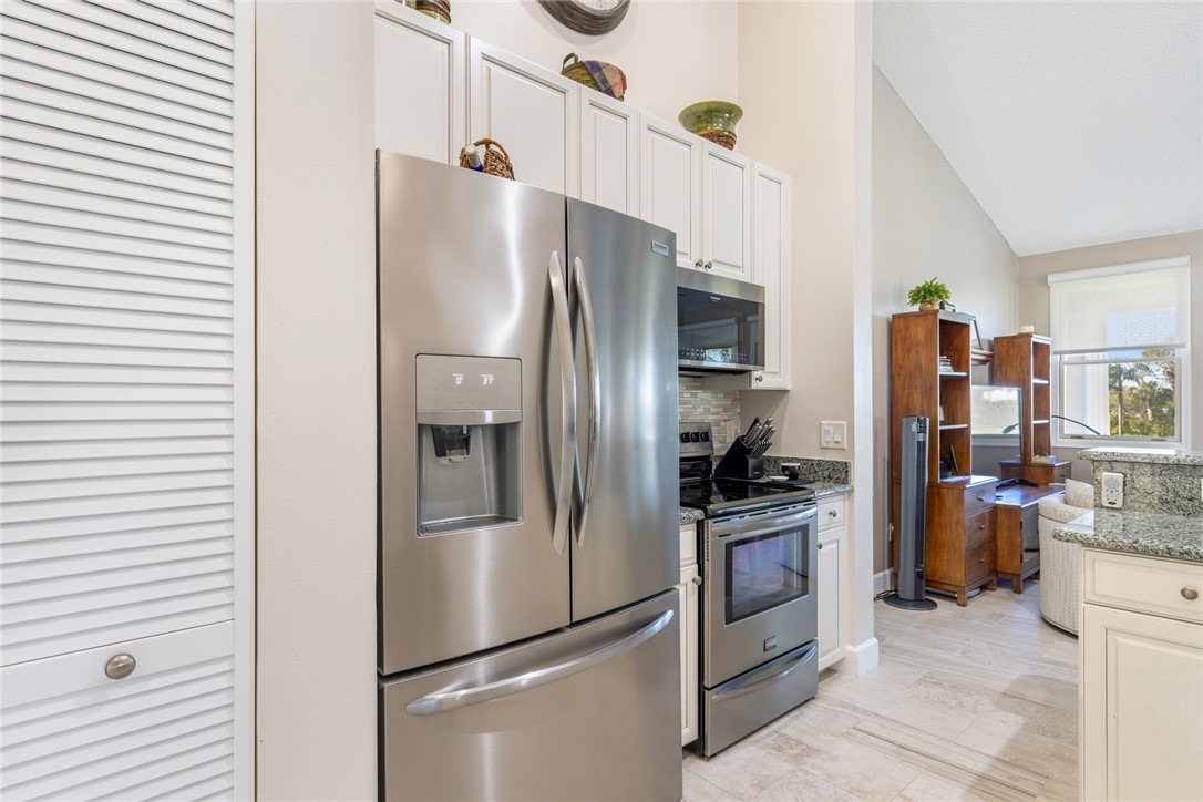 Stainless steel French door refrigerator with ice and water dispenser