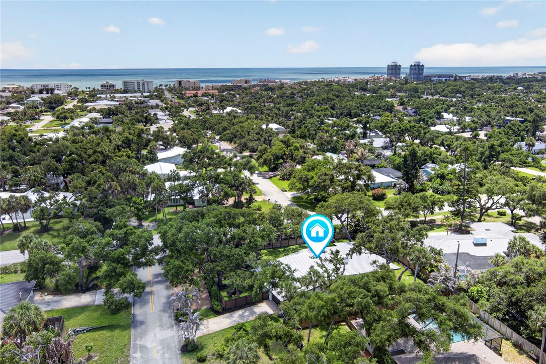 Aerial perspective showcasing the property's location within a tree-canopied neighborhood