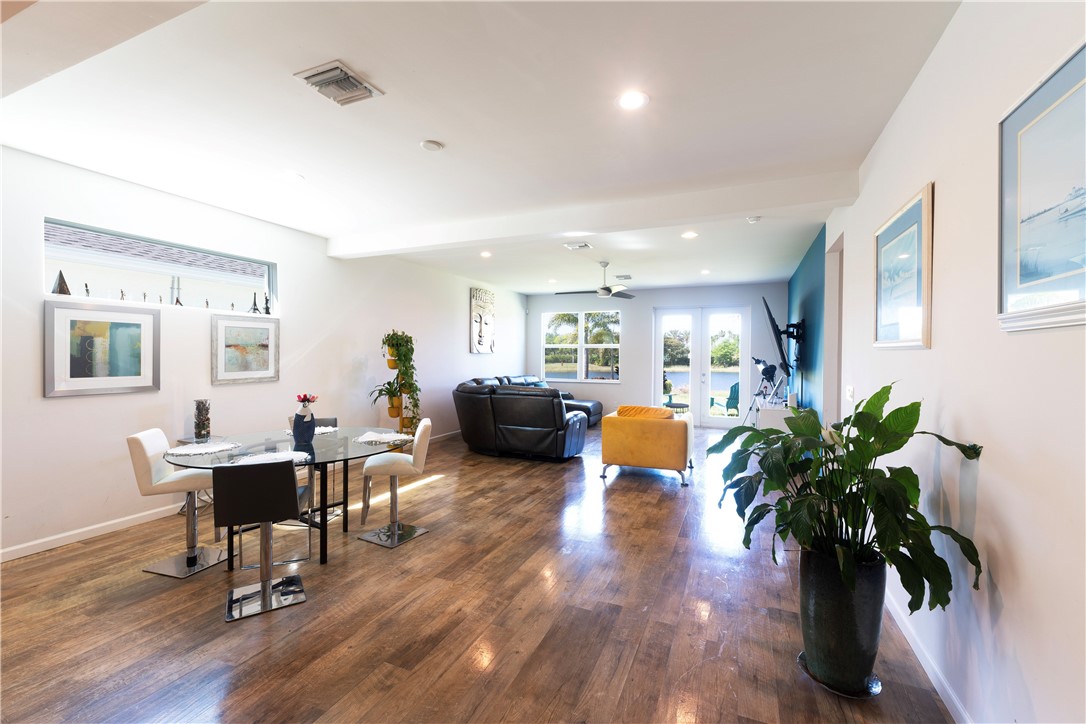 Spacious interior featuring wood-finish flooring, recessed lighting, and white walls