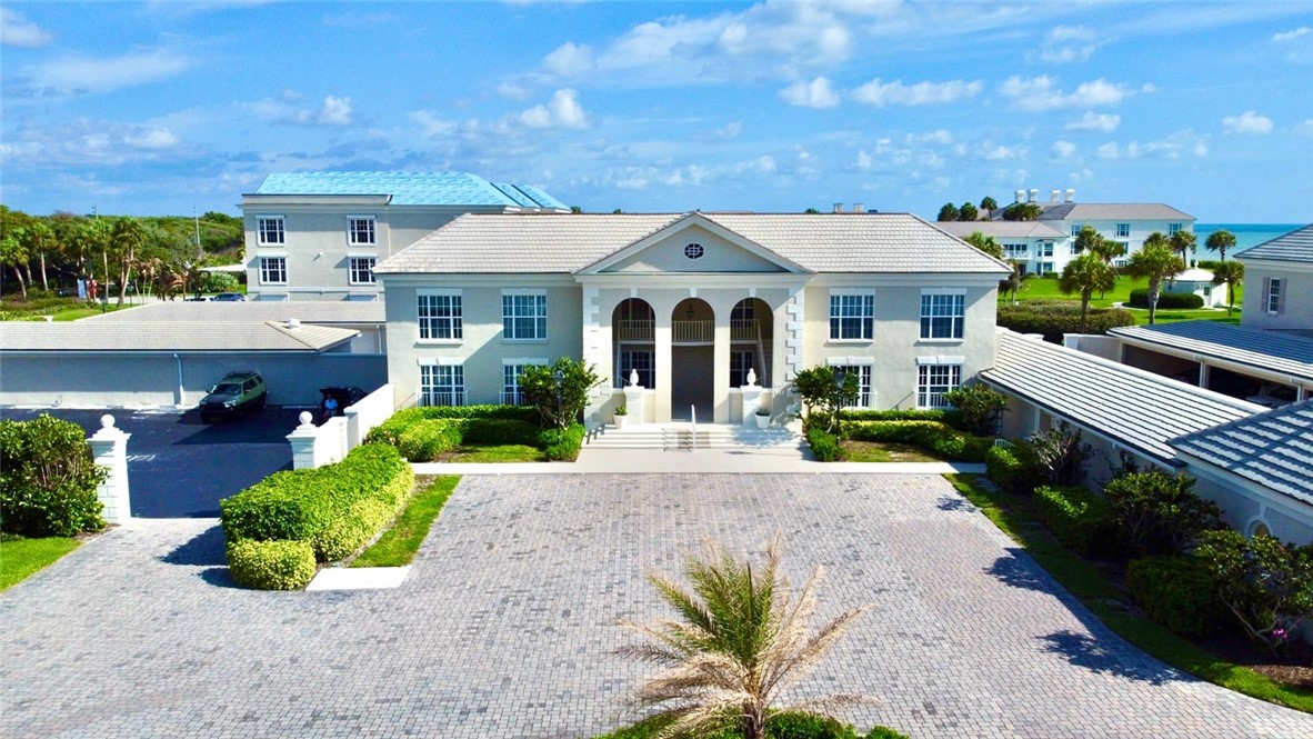 Grand exterior featuring a classical architectural facade with arched portico