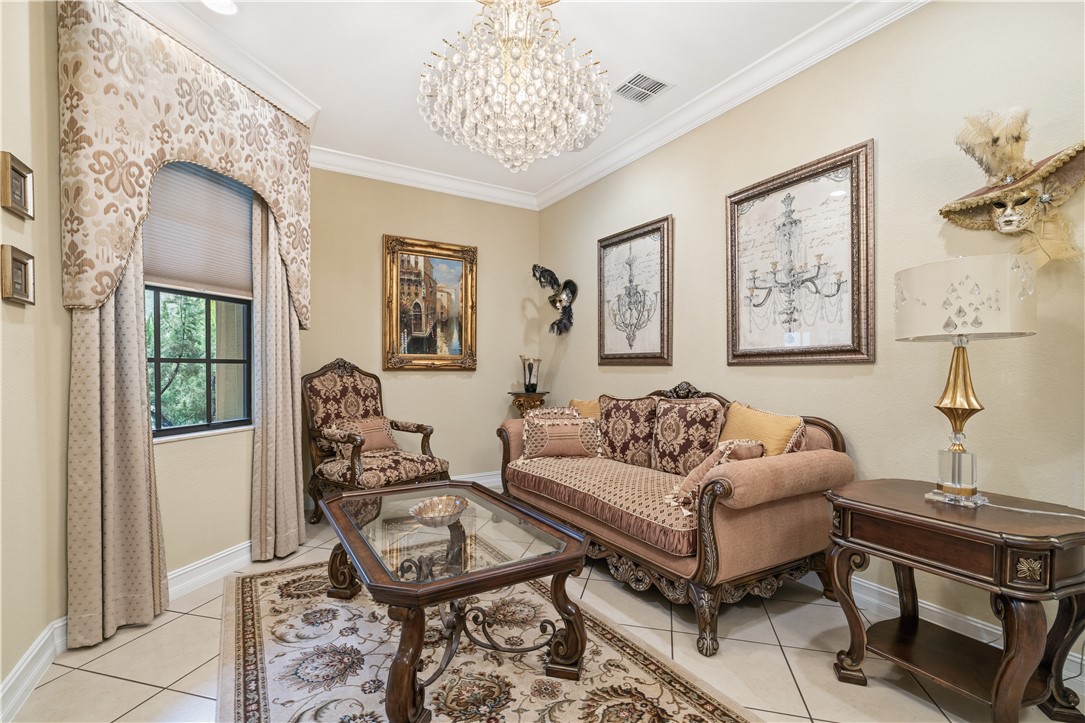 Recessed ceiling lighting complements the central crystal chandelier