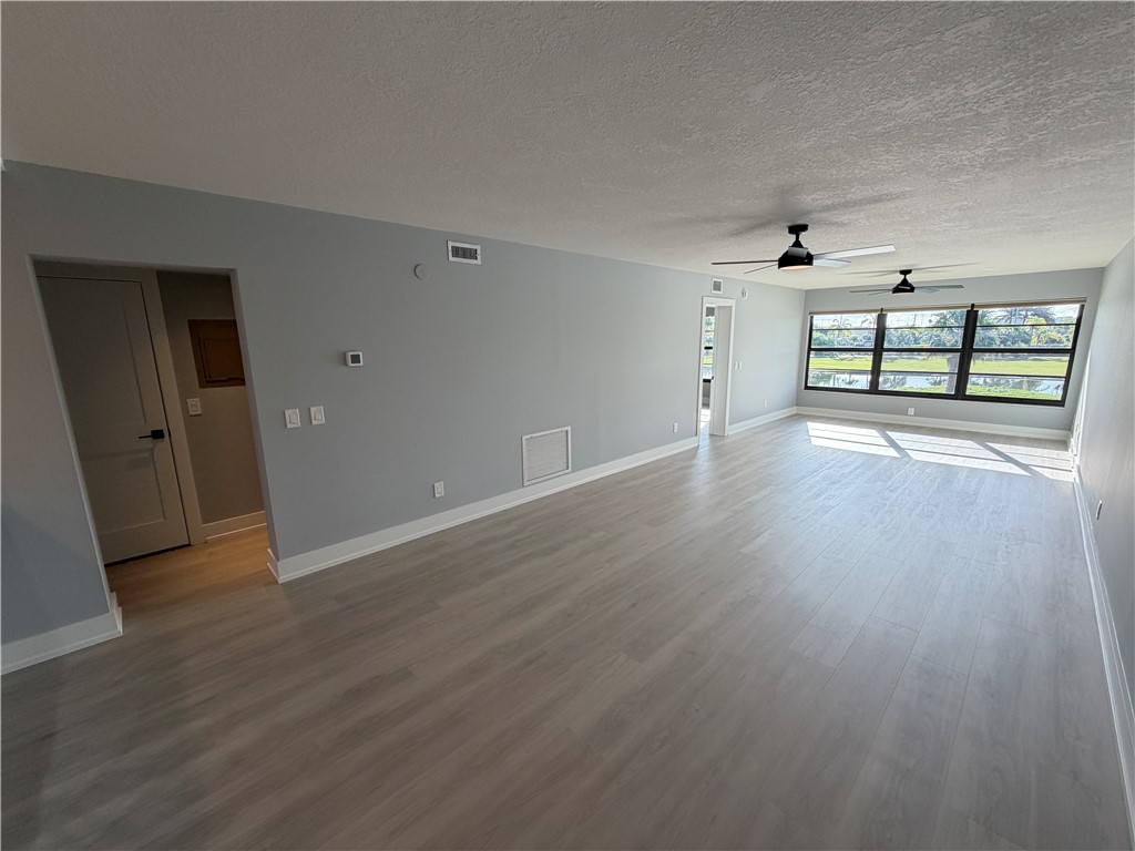 Spacious open floor plan featuring light luxury vinyl plank flooring