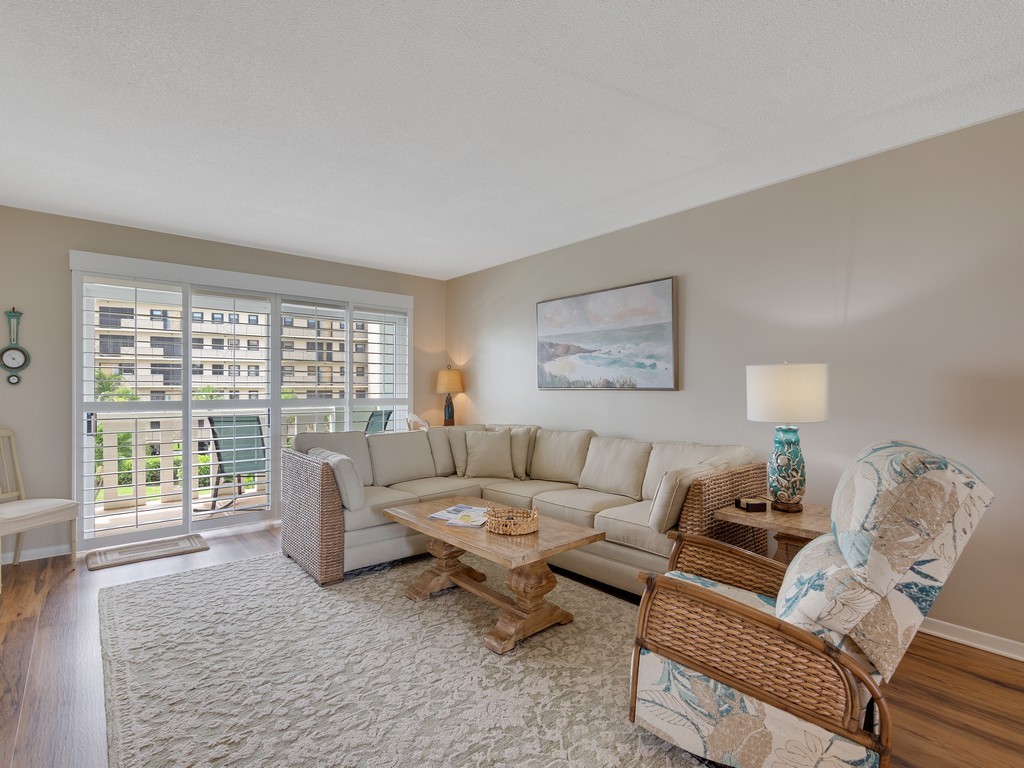 Living area with wood finished floors and baseboards