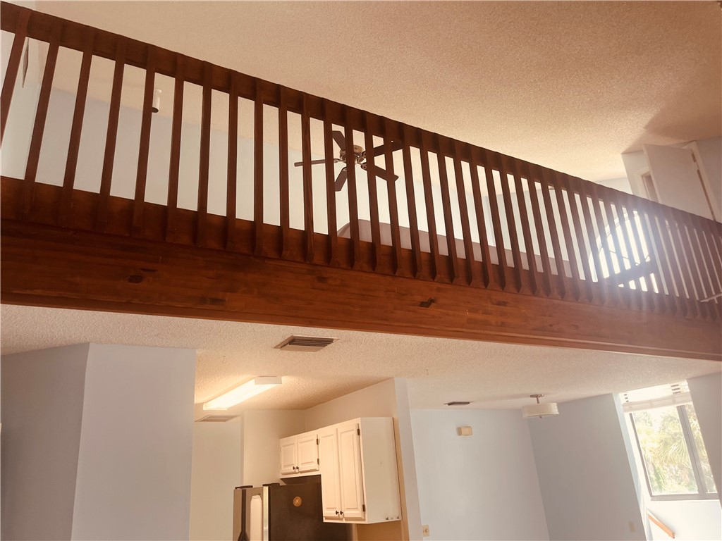 Wood-finish railing with vertical balusters