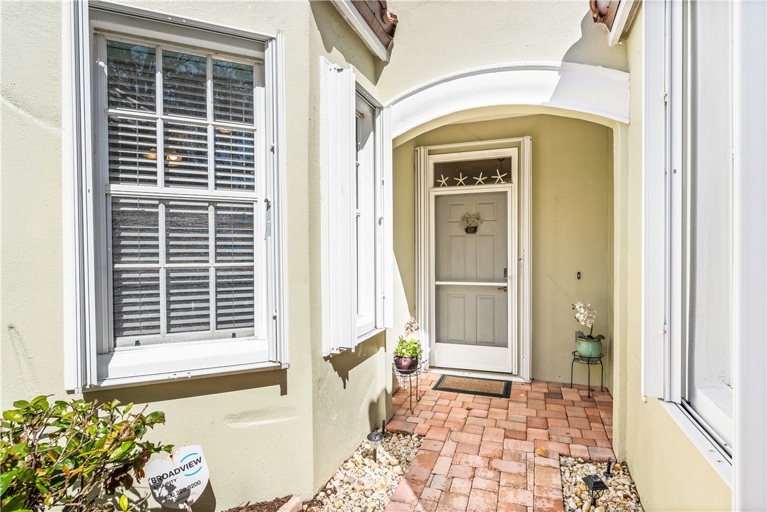 Entrance to property with stucco siding
