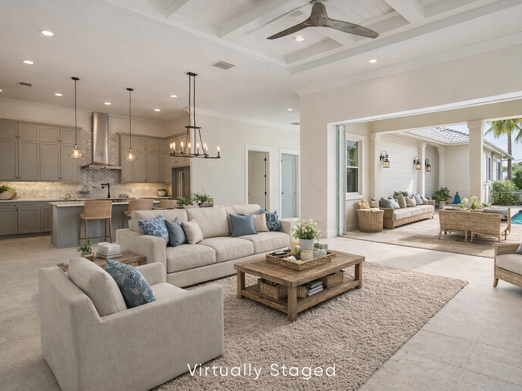 Living area with hanging lights, ceiling fan, ornamental molding, and coffered ceiling