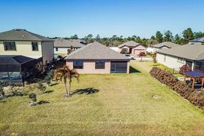 View of grassy yard featuring a residential view