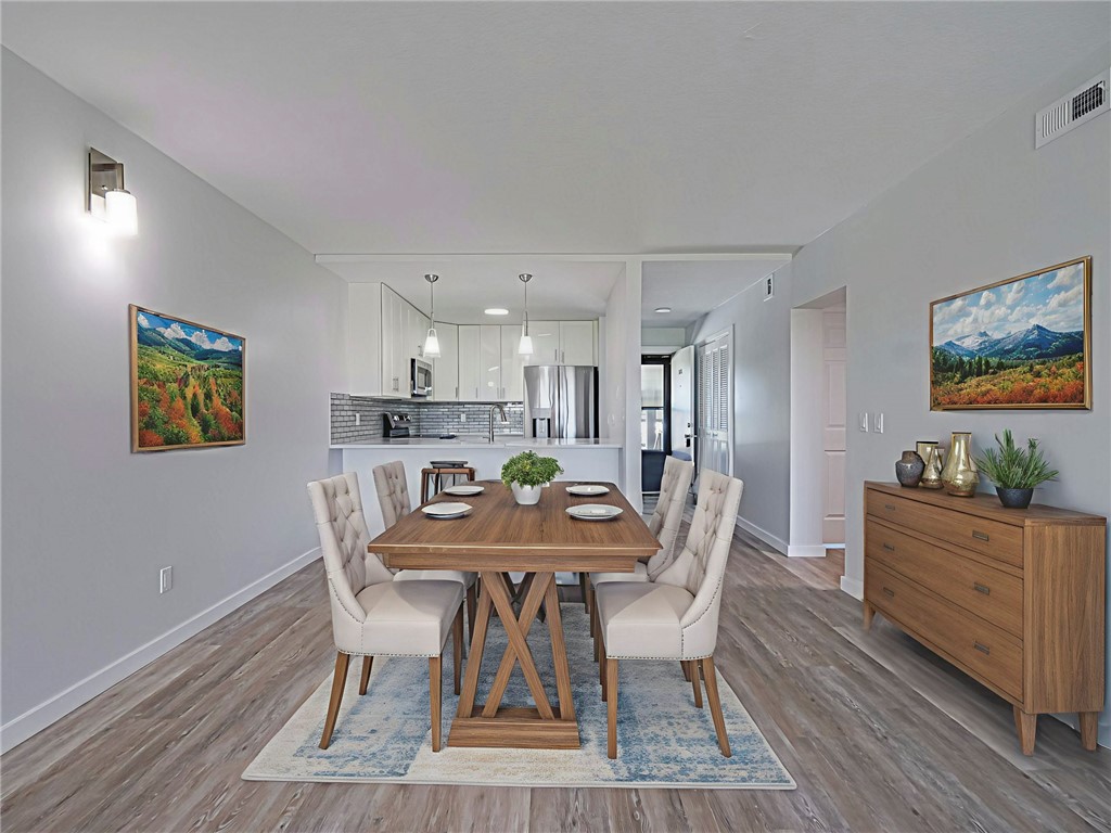 Digitally staged dining space and new baseboards & doors