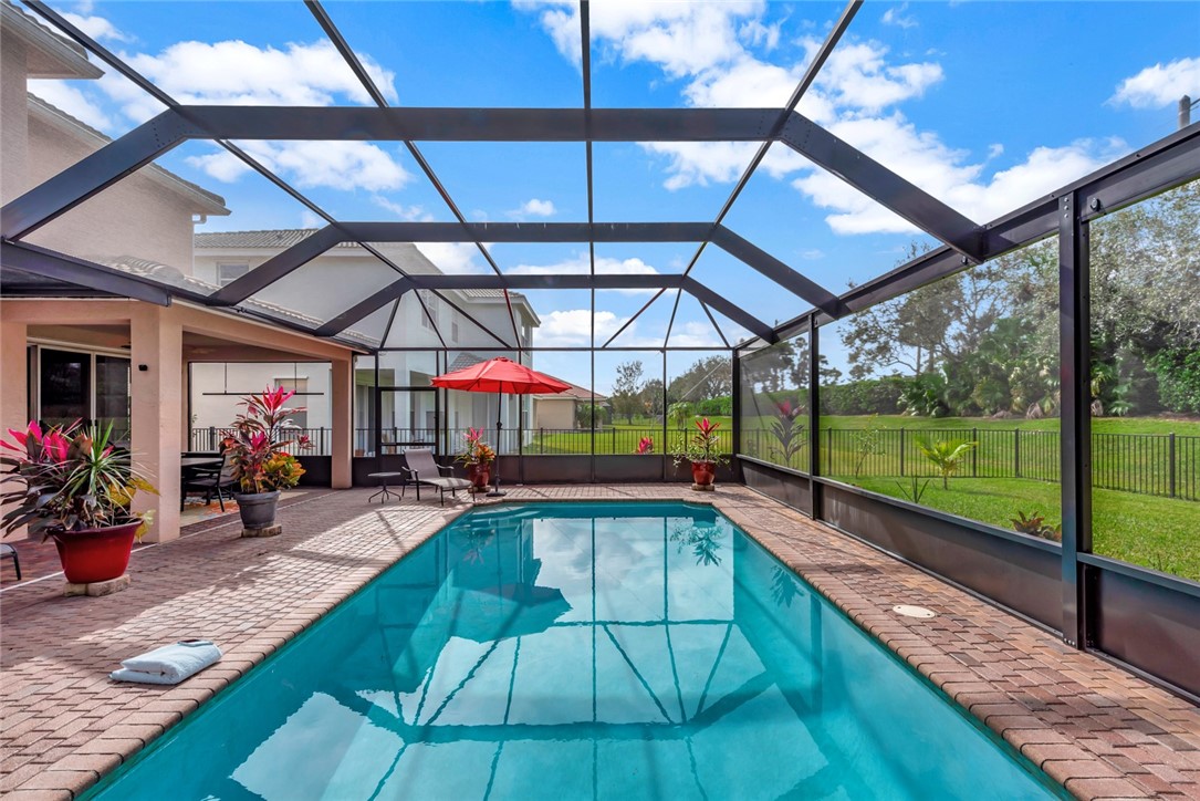 Private screened pool with extended pavered lanai
