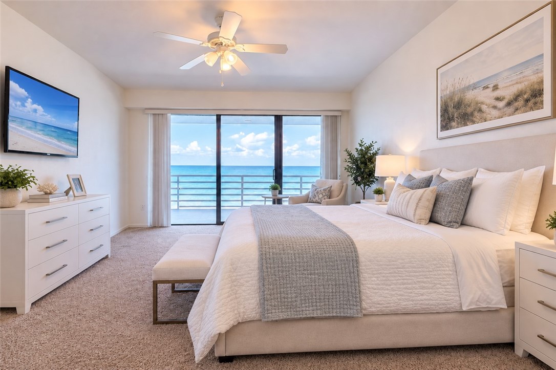 VIRTUALLY STAGED PRIMARY SUITE WITH OCEAN VIEWS AND BALCONY