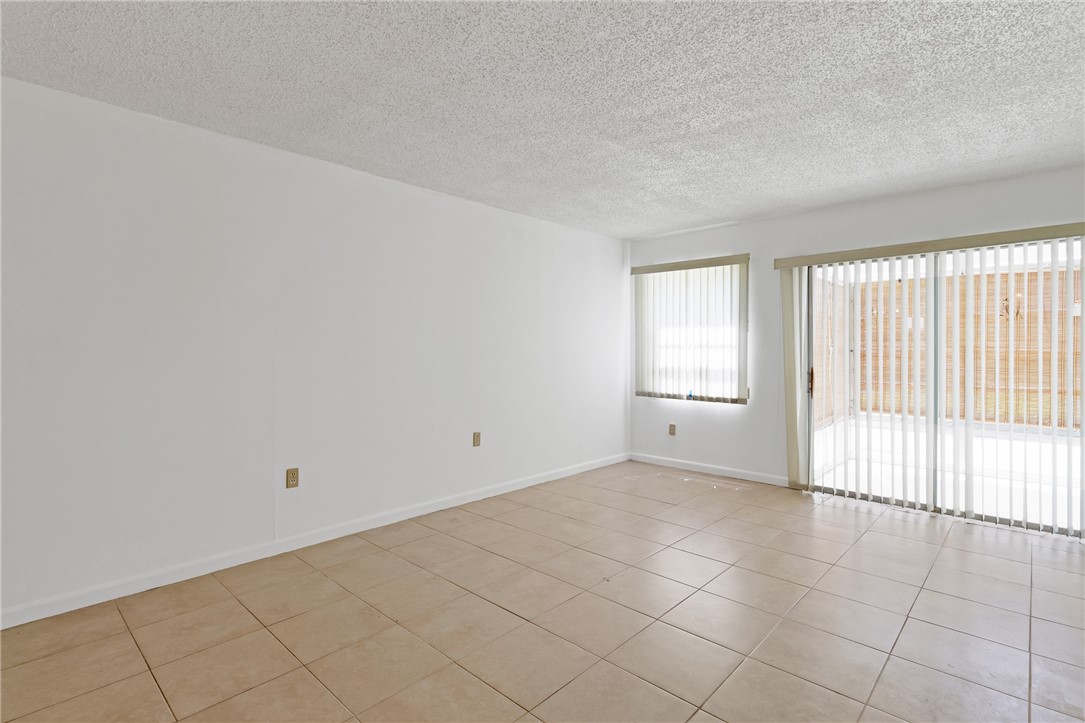 White walls with light-colored tile flooring