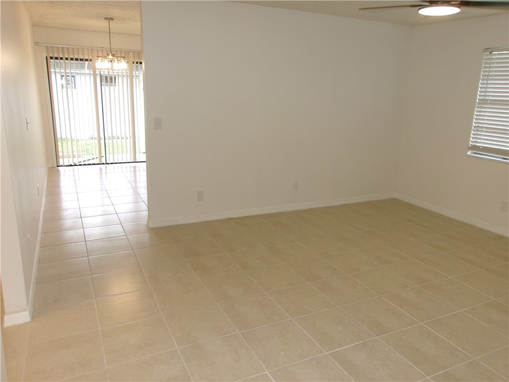 Neutral tone tile flooring throughout