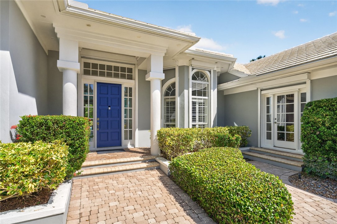 Entryway has transom and sidelight windows; second private entry into office.