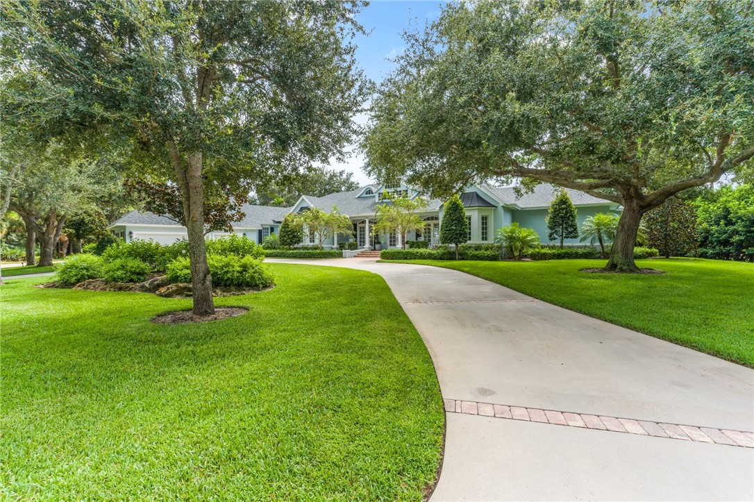 CUSTOM ESTATE HOME WITH SWEEPING CIRCULAR DRIVE AND 3-CAR GARAGE