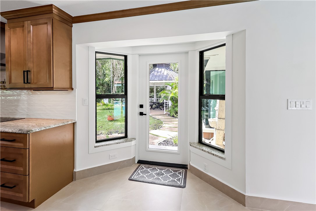 Bay window with a glass panel door and two flanking windows
