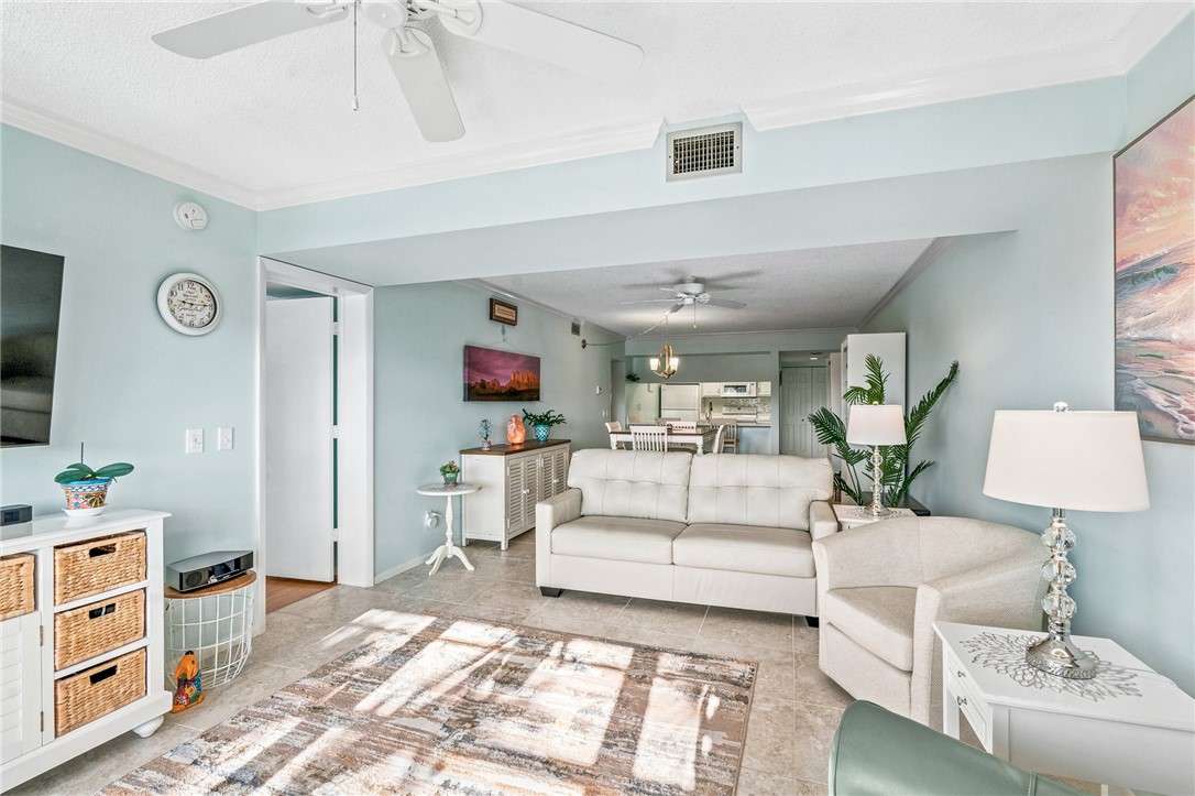 Recessed ceiling lighting, crown molding, and ceiling fans
