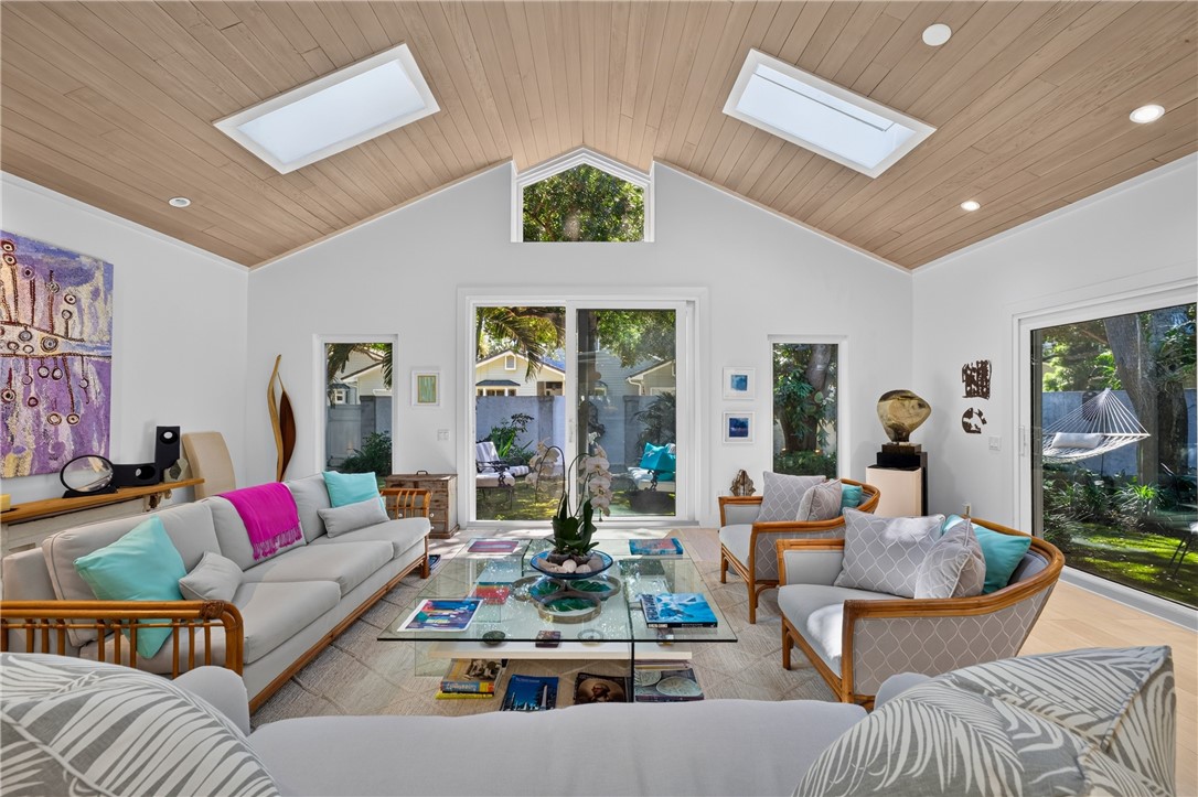 Tongue and groove wood ceiling adds an architectural sophistication to the living space. All windows and doors are impact glass.