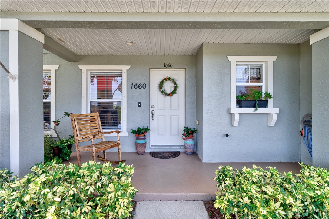 Inviting front porch with a paneled ceiling, recessed lighting, and decorative window boxes