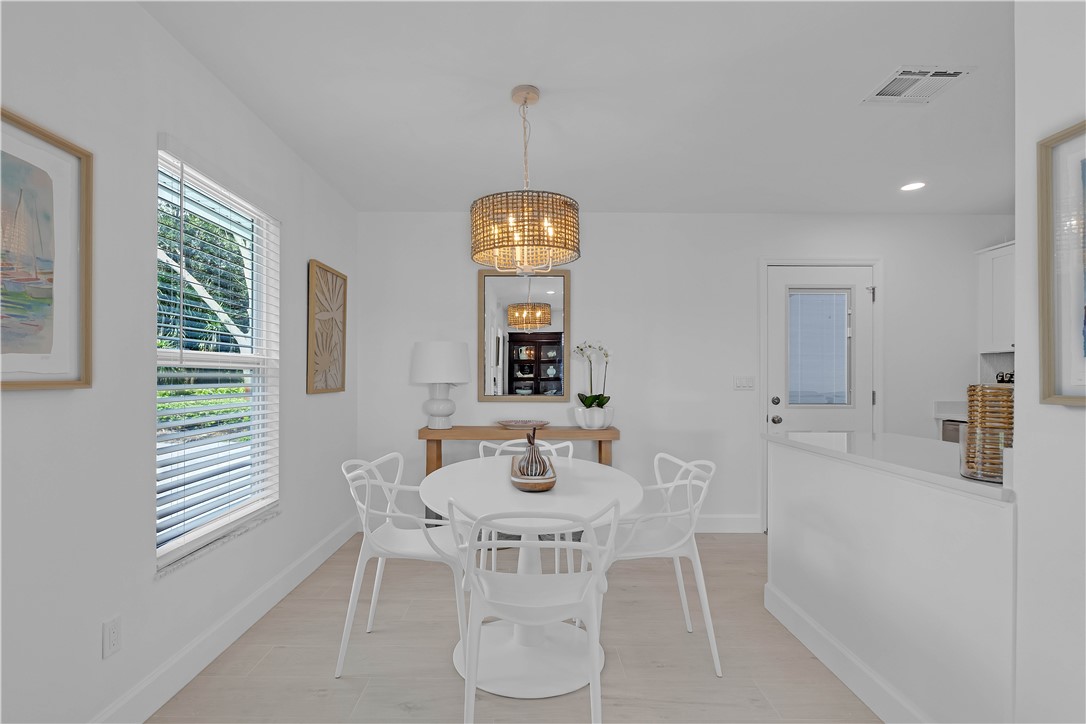 Dining space featuring a chandelier, recessed lighting, and light wood-type flooring