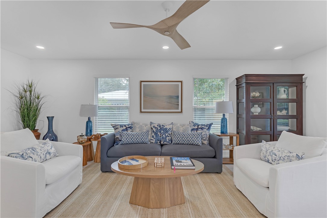 Living room with recessed lighting and ceiling fan