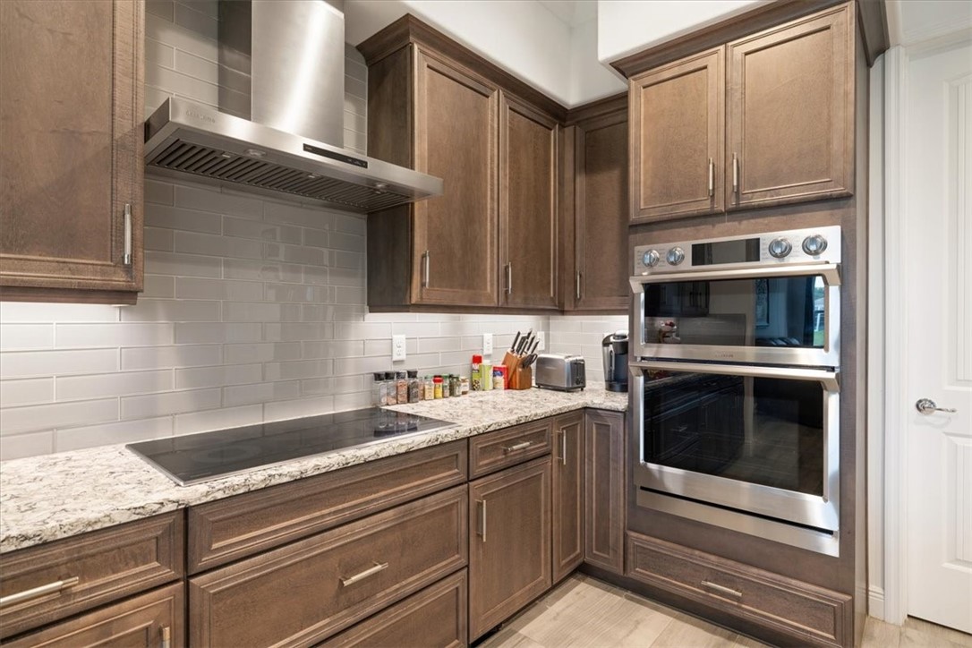 Cooktop with hood; double oven