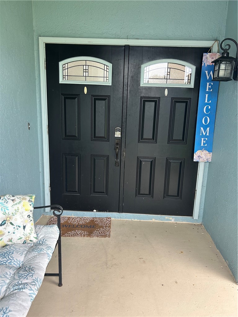 Double entry doors with transom windows