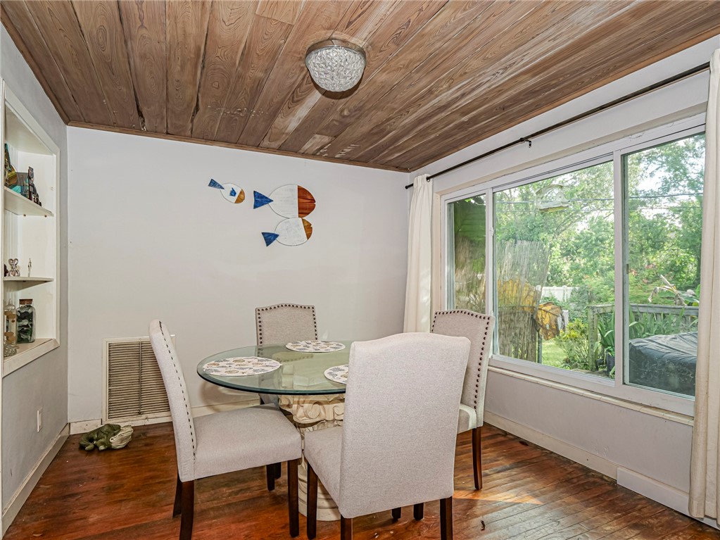 Large enclosed porch serves as dining or family room