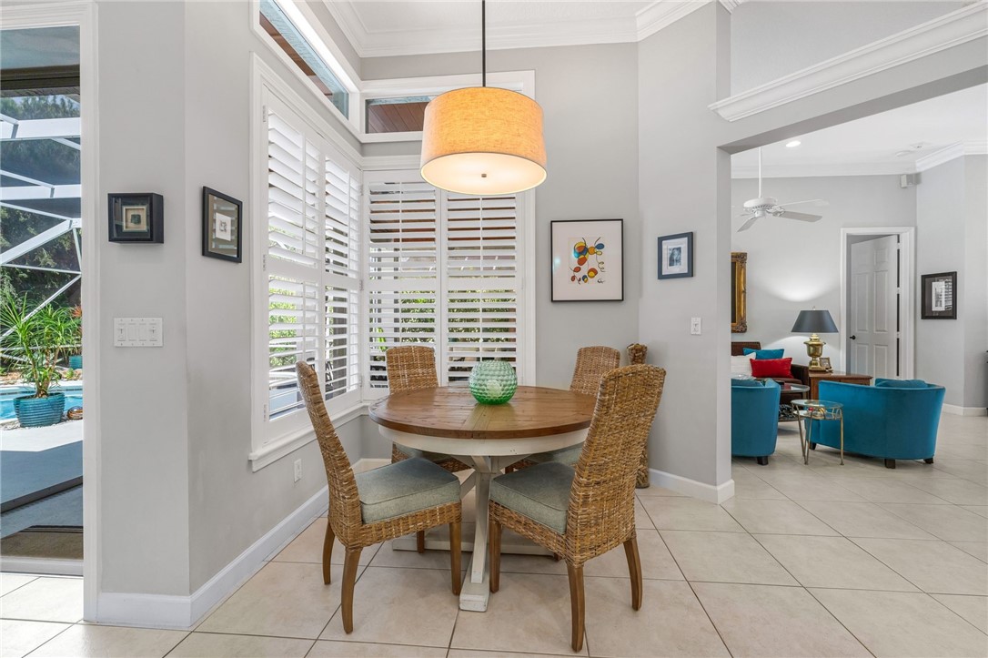 Breakfast nook with view of lanai and pool
