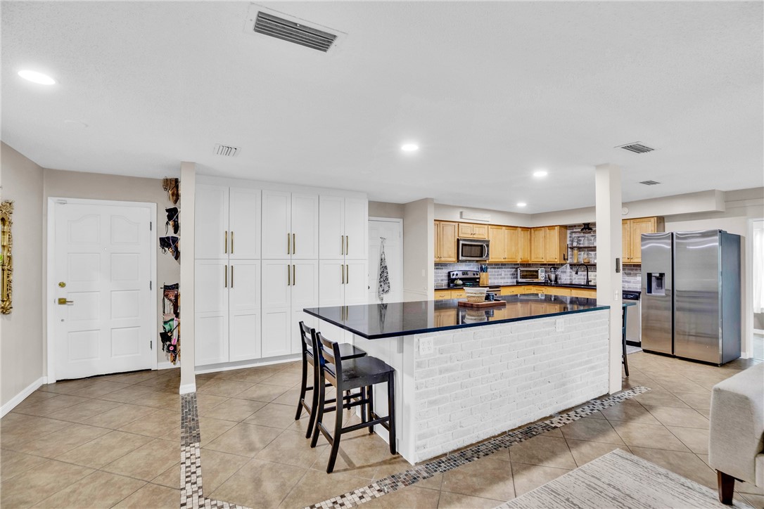 Foyer opens to kitchen with ample storage
