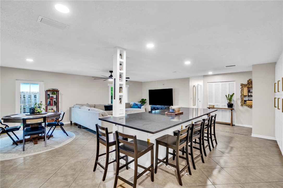 Island kitchen overlooking dining and living area
