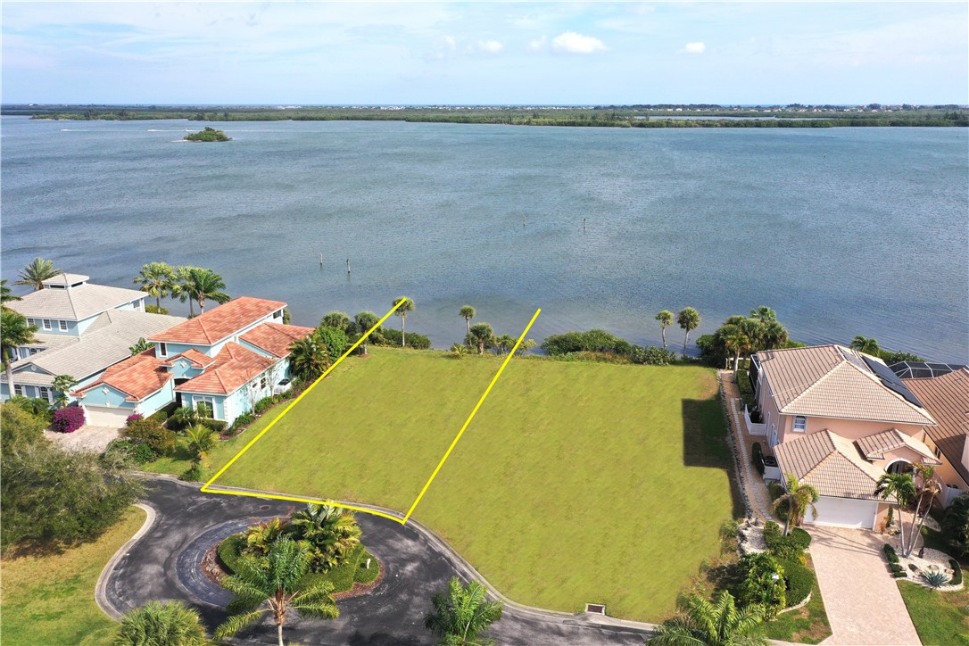 Aerial overview of property's location featuring a nearby body of water and property boundaries highlighted