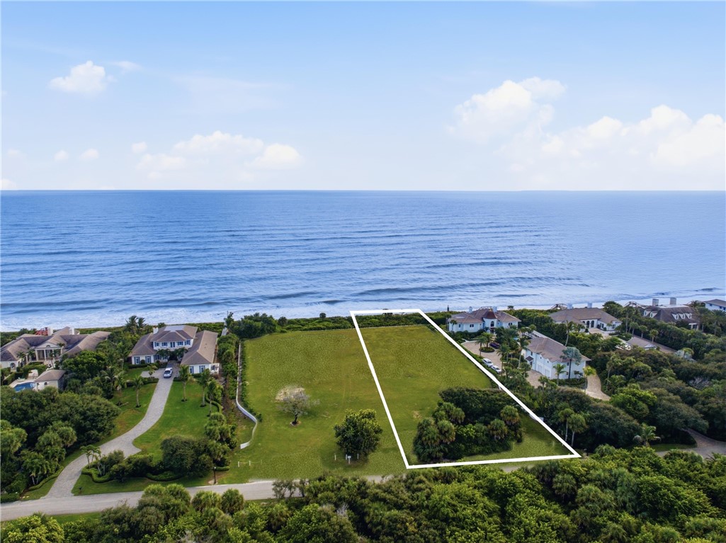 Vacant coastal parcel featuring direct ocean frontage and established native landscaping