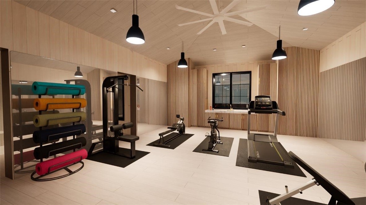 Vaulted wood-paneled ceiling, large-format tile flooring, integrated wall-to-wall mirror, built-in cabinetry with stone countertop, and contemporary pendant lighting