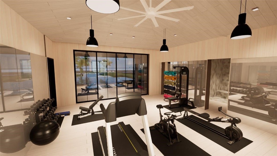 Fitness area featuring light-toned wood-paneled walls and ceiling, full-height wall mirrors, matte black pendant lighting, a ceiling fan, and black metal-framed sliding glass doors