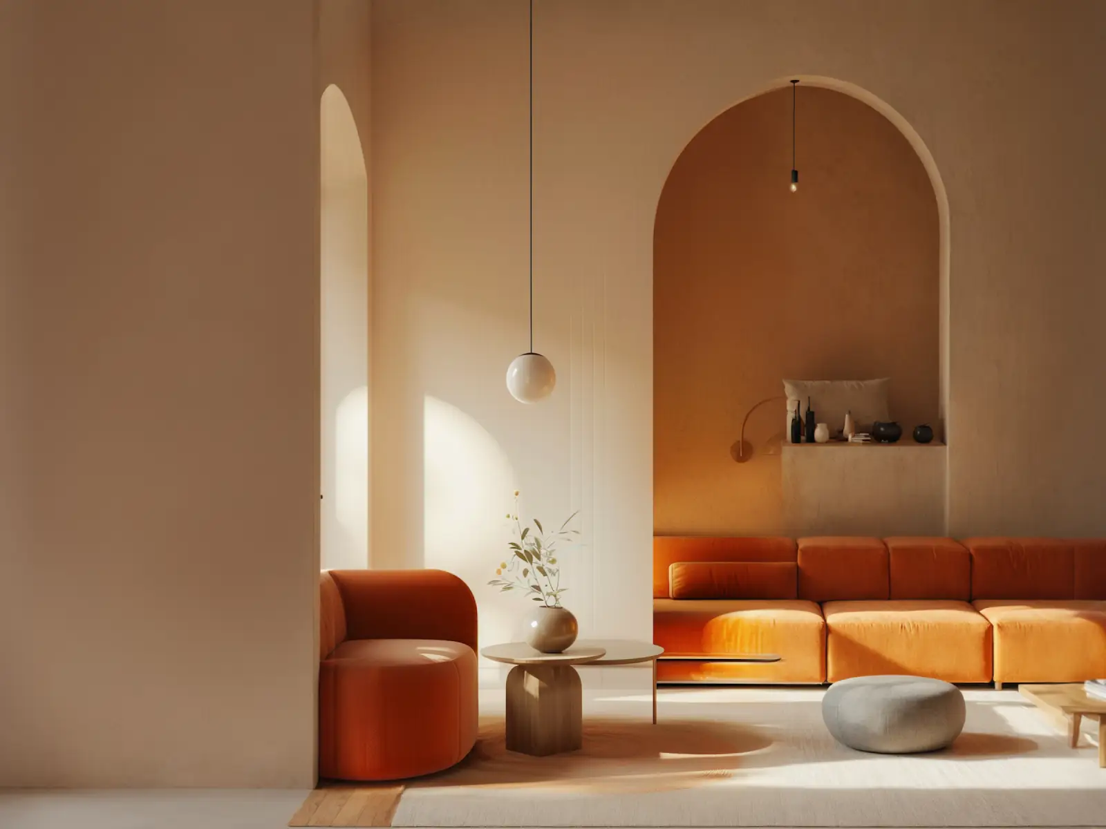 Modern minimalist living room with an orange curved armchair, matching sectional sofa, and round wooden coffee table with a vase of flowers. The room features arched architectural details and warm, soft lighting that casts shadows on beige walls and a neutral floor rug, complemented by a gray round pouf and a small pendant light hanging from the ceiling.