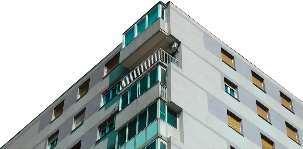 Corner of a multi-story modern building with white facade, glass balconies, and yellow window shutters, viewed from below against a black background.