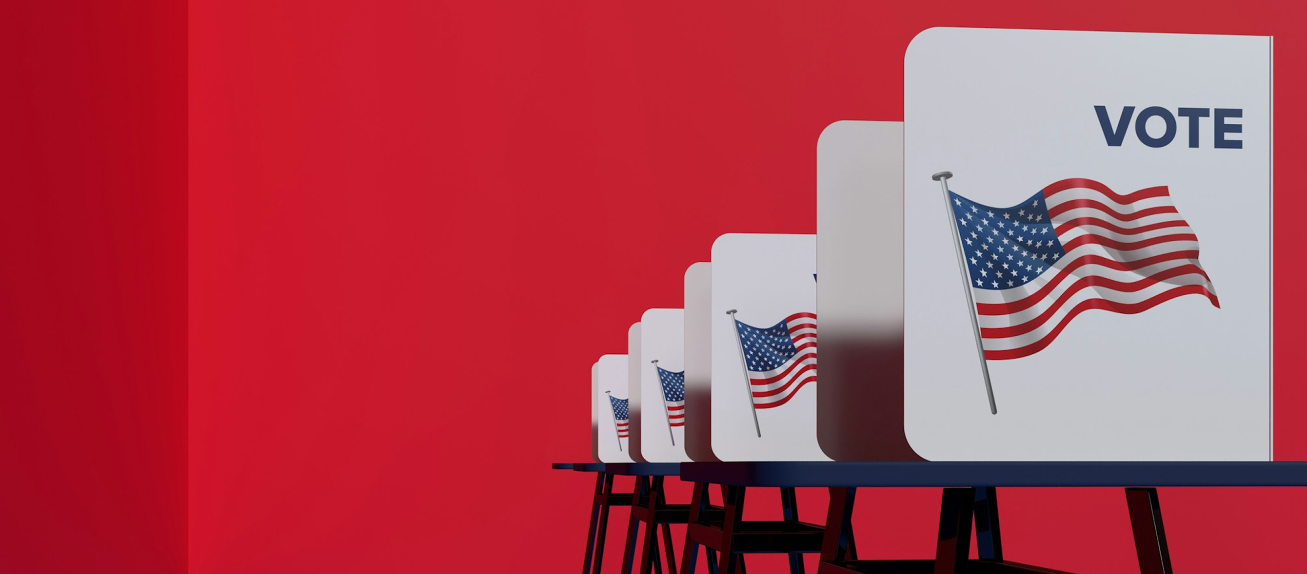 Row of voting booths with white dividers displaying a waving American flag and the word 'VOTE' against a red background.