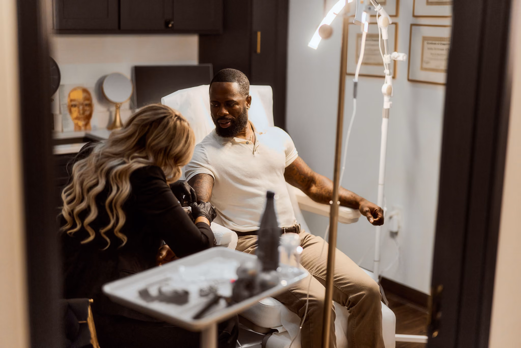A client receiving an IV infusion in the VIV Wellness lounge