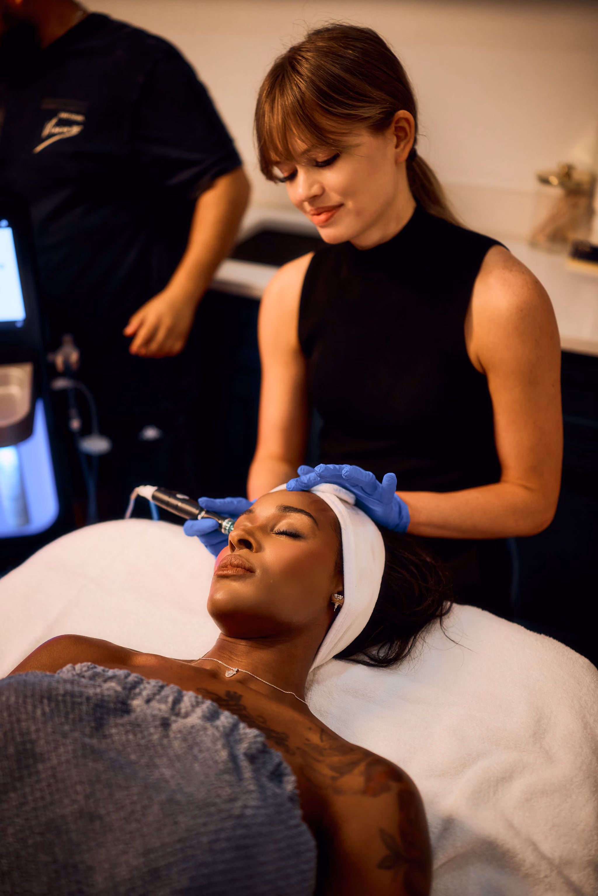 Provider preparing a patient for treatment at VIV Wellness Dallas