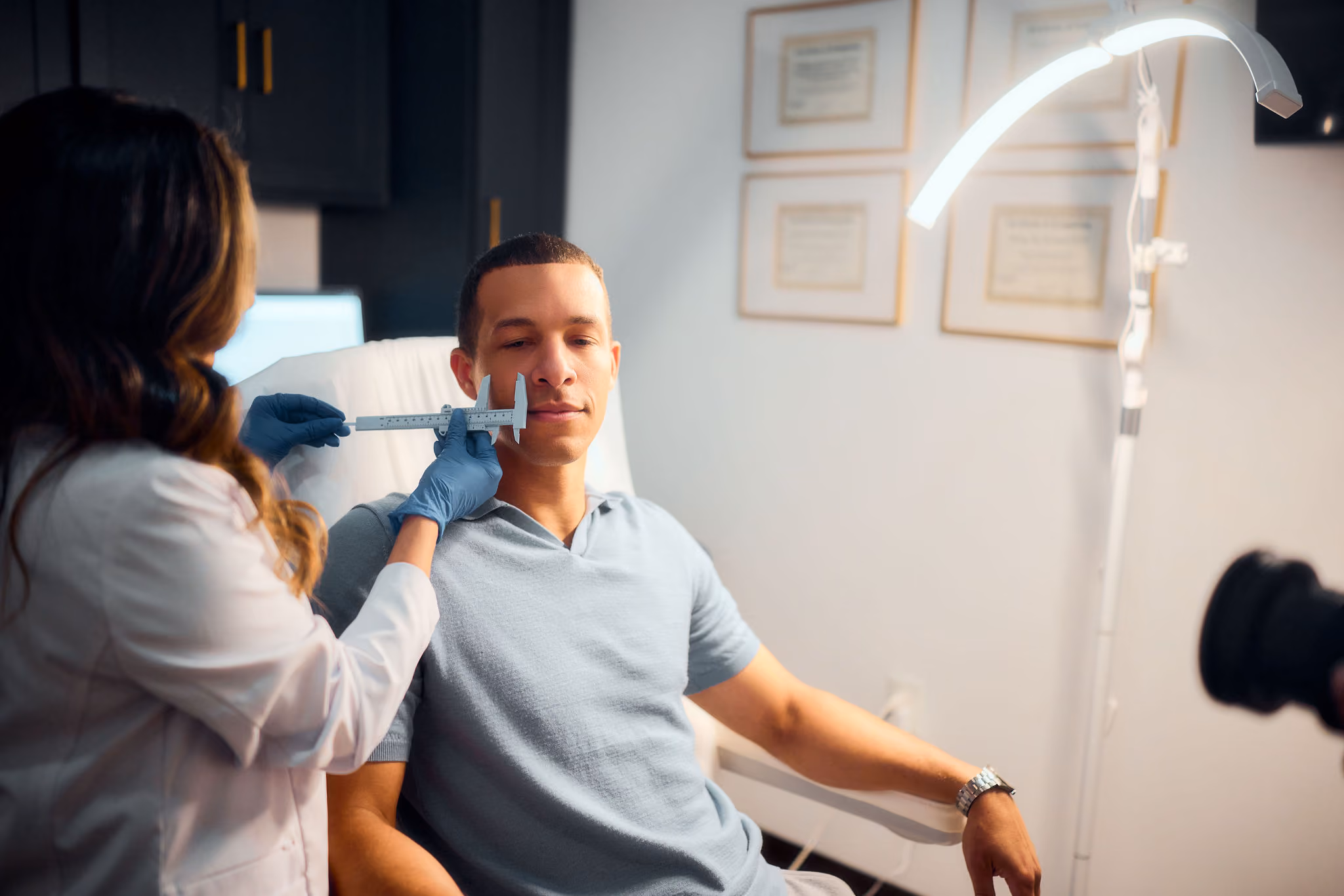 A male patient being assessed before treatment at VIV Wellness