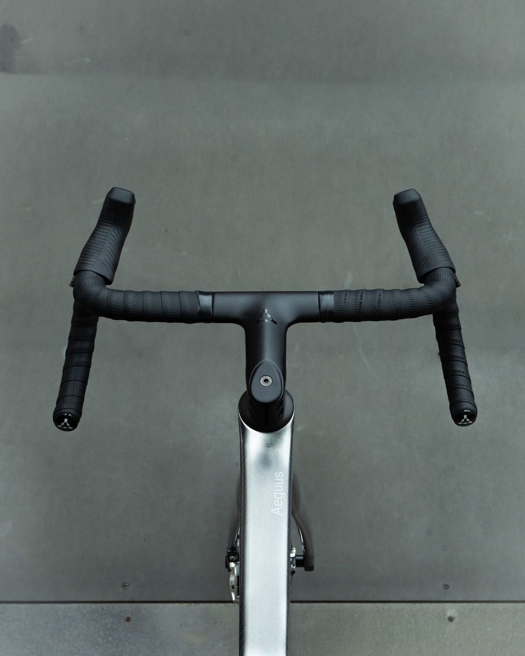 Close view of the Polymer Rover handlebar tops, tape and stem