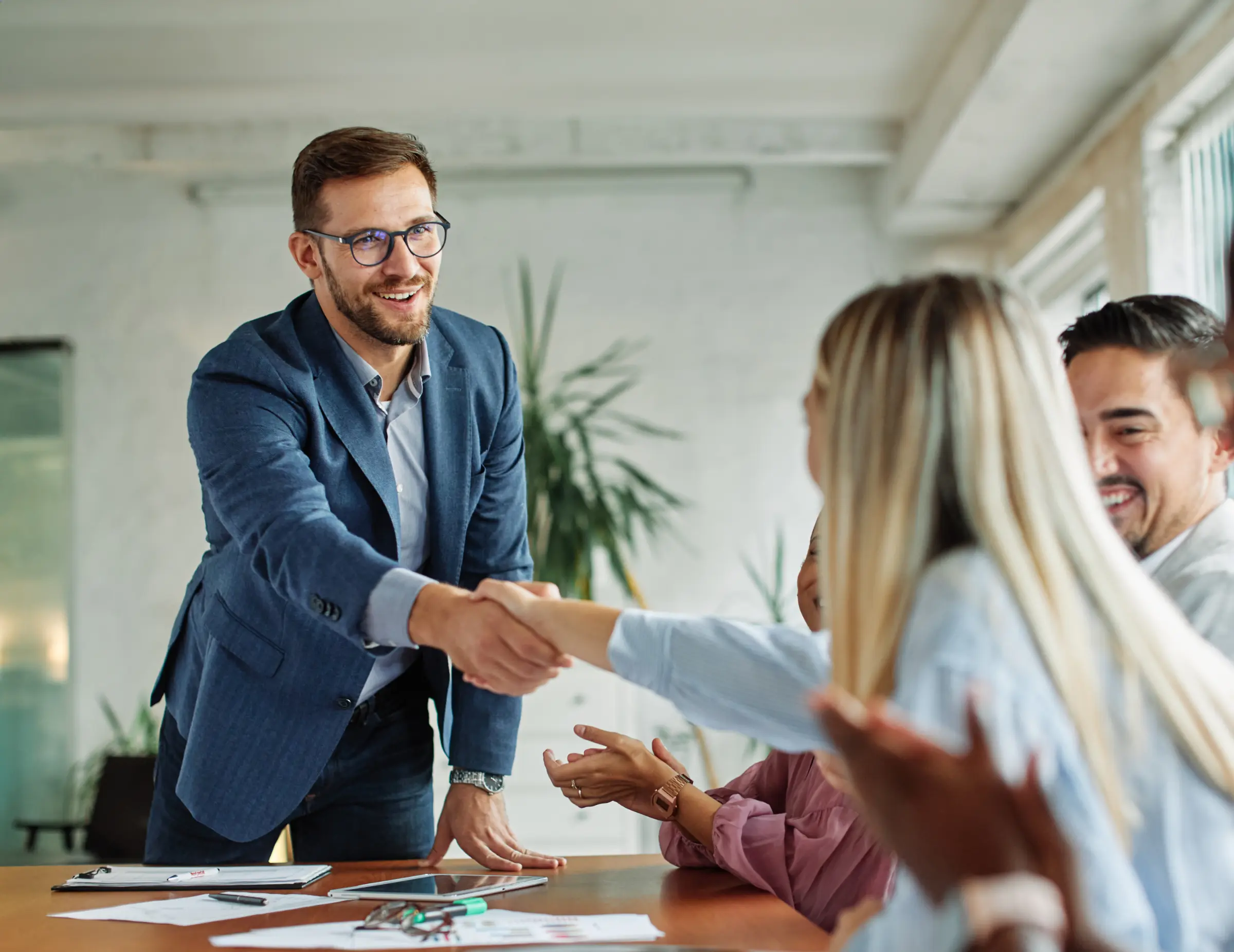 Young business people meeting office handshake.